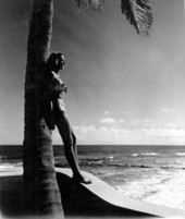 Florence Lainhart posing against a palm tree - Palm Beach, Florida.