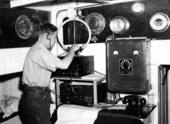 J. J. Williams operating the radio equipment on the "Nor'easter"
