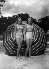 Unidentified women stand on the beach area of the springs - Sanlando Springs, Florida