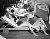Marianne McConkey and Doris Thrasher sunbathing at the Roney Plaza Hotel