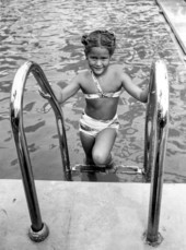 Child climbs out of the Vanderbilt pool - Miami Beach, Florida