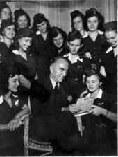 Captain Eddie Rickenbacker autographing for a girl scout
