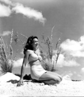 Nancy Stilley posing with sea oats in a beach scene - Cypress Gardens, Florida