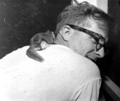 Owner getting an earful from his pet squirrel