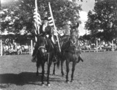 Two riders hold the American flag - Bonifay, Florida