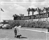Unidentified woman and a dog at the Florida Welcome Station