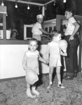Two young brothers eating cotton candy at Quincy's Tobacco Festival - Quincy, Florida