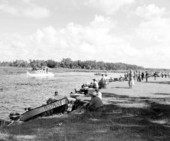 View of a crowd watching a boat traveling on the Kissimmee River
