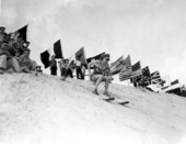 Young woman skis down the mountain of sand - Fort Meade, Florida .