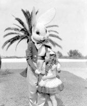 A young girl poses with the "easter bunny"