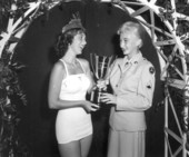 The newly crowned Miss New Smyrna Beach, Gayle Hester, receiving her trophy - New Smyrna Beach, Florida