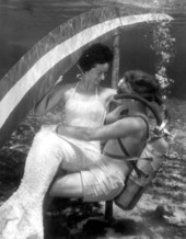 Diver holds onto a mermaid at Rainbow Springs - Dunnellon, Florida .