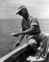 Conservation official Ralph Odum landing a ladyfish at Ten Thousand Islands, Florida.