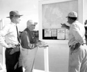 Men checking a Flamingo Park map - Flamingo, Florida