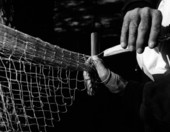 H. O. Marshall knitting a cast net - Apalachicola, Florida