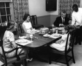 Governor LeRoy Collins and wife dining with two of their daughters.