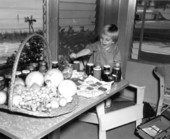 Ginny Cobb trying to get cookie on the table - Fort Pierce, Florida.