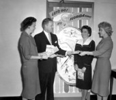 Mr. Jarrard and three ladies with advertisements for Florida - Tallahassee, Florida