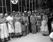 Wendell Jarrard posing with people dressed up as farm folk.