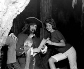 Cheryl Aurland poses with a pirate and parrot displayed at the London Wax Museum - Saint Petersburg Beach, Florida