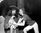 Cheryl Aurland poses with a pirate and parrot displayed at the London Wax Museum - Saint Petersburg Beach, Florida