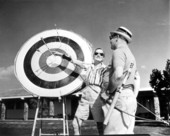 A couple checking the result of the target practice