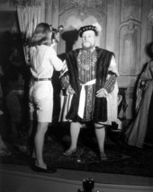 A young woman taking a picture for King Henry VIII displayed at Potter's Wax Museum - Saint Augustine, Florida