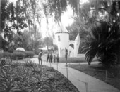 Children having their picture taken in front of faux castle at Fairyland in Tampa, Florida.