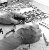 A Univis, Inc. employee assembling eyeglass frames - Fort Lauderdale, Florida