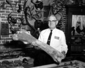T.T. Wentworth Jr. holding a huge bone at the museum - Pensacola, Florida.