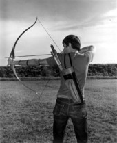An archer takes aim to shoot arrow at River Ranch Acres - Polk County, Florida.