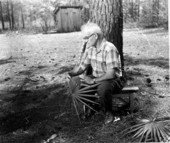 Man weaving palmetto fronds