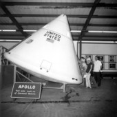 Tourists look at a mock up of the Apollo command module - Cape Canaveral, Florida