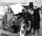 People admiring automobile at an antique car show - Ormond Beach, Florida
