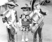 Three children dressed in Spanish costume at Ybor City - Tampa, Florida.