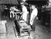 Men frying fish at the Florida Seafood Festival - Apalachicola, Florida