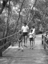 A family taking a walk on the footbridge at a resort - Amelia Island, Florida