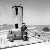 Man in colonial costume standing by cannon - Saint Augustine, Florida