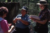 Florida Park Service Environmental Protection employee showing Spanish Moss to visitors during tour at the Hernando de Soto State Archaeological Site - Tallahassee, Florida..
