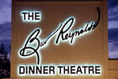 Close-up view showing the Burt Reynolds Dinner Theatre sign at night - Jupiter, Florida.