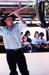 Gatorland theme park employee handling a rattlesnake - Orlando, Florida.