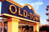 Close-up view of Old Town shopping, dining and entertainment attraction sign in Kissimmee, Florida.