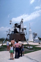 Tourists viewing lunar module on display in the Kennedy Space Center rocket garden.