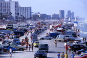 View showing cars and crowds at Daytona Beach, Florida.