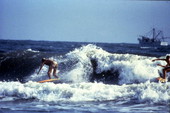 People surfing at Daytona Beach.