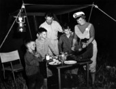 A lady cooking for her family at camp - Kissimmee River, Florida