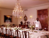 A servant setting up the dining room in the Governor's Mansion - Tallahassee, Florida.