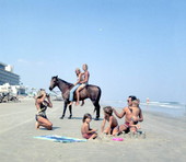 Couple on horse by woman photographing her family at the beach - Jacksonville, Florida