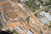 Aerial view looking northwest over construction at Centennial Field at Cascades Park in Tallahassee, Florida.