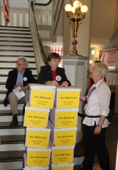 Members from League of Women Voters with petitions at the Old Capitol during the Never Again Rally in Tallahassee.
